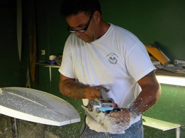 Marcho Pacheco crafting a surfboard